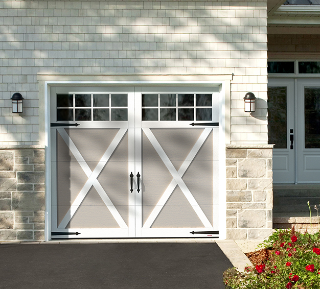 Single Carriage House Style garage door with the Eastman E-21 design in the Claystone door colour with Ice White overlays