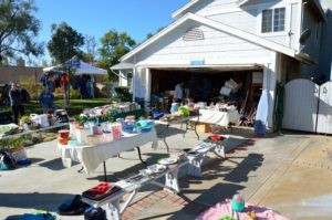 Driveway with a garage sale going on
