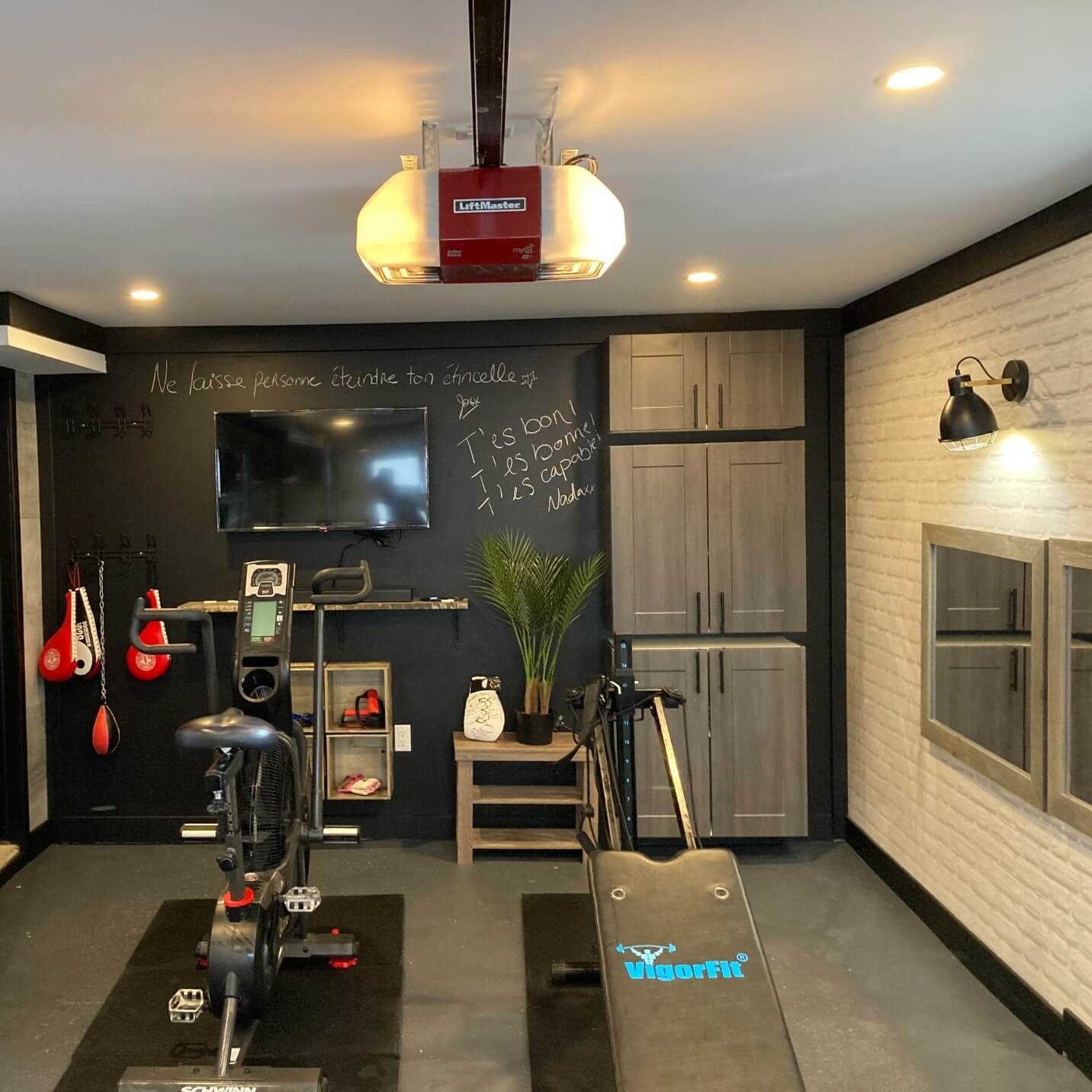 Finished walls, built-ins, a brand new LiftMaster door opener, Gregory really has an awesome gym!