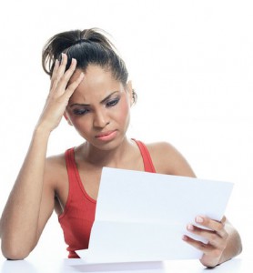 Woman looking at her electricity bill