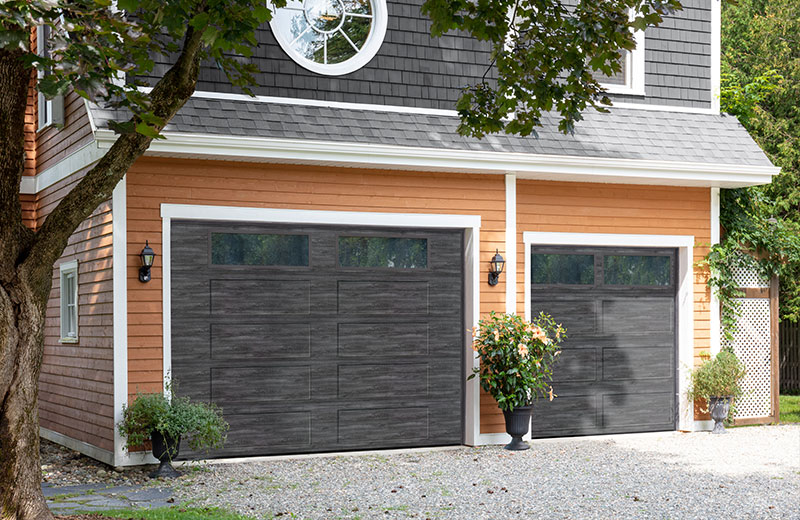 Vantage Shaker-Flat Long garage doors, 10' x 8' and 7' 6'' x 7' in Weathered Grey Faux Wood with Clear windows