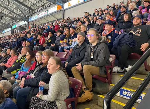 Garaga employees from Barrie facility in Ontario cheering for their favourite hockey team, the Colts, in a big tournament.