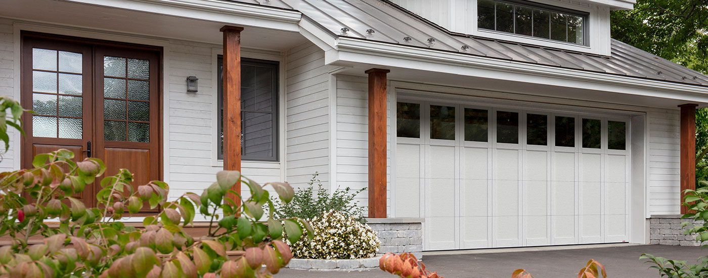 Transitional style house White and Black Princeton P-31 double garage door, Glacier White, Panoramic Clear windows