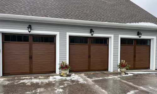 Eastman E-11 three garage doors. 10' x 8', Chocolate Walnut Faux Wood, Orion 4 Rectangle Clear windows