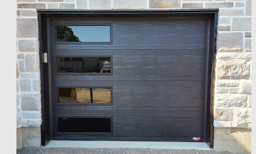 Stone house with Moderno 2 beads garage door, 9' x 7', Black, windows layout: Left-side Harmony