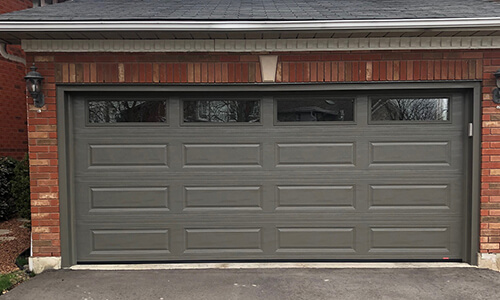 Acadia 138 Classic XL garage door, 16' x 7', Dark Sand, Clear windows