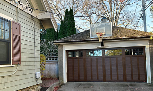 Eastman E-13 garage door, 16' x 7', Chocolate Walnut door and overlays, 8 lite Panoramic windows with Clear glass