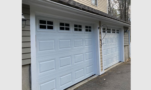 Acadia 138 Classic CC garage door, 9' x 7', Ice White, Clear windows