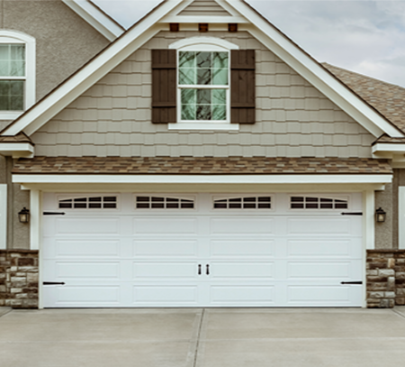 Simple Traditional Style garage doors with the Regal Shaker‑Flat Long design in the Dark Walnut colour