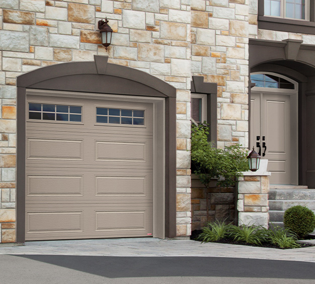 Single Traditional Style garage door with the Classic XL design in the Claystone color