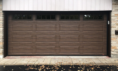 Standard+, Prestige XL garage door, 16' x 7', Chocolate Walnut Faux Wood, windows with Richmond Inserts