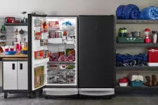 Big freezer with an open door in a garage