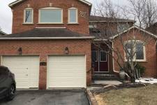 2-storey brick house with an attached garage, two single garage doors in Classic Mix Design, Desert Sand color