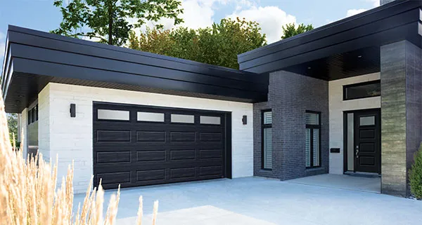 Contemporary style house with Standard+ Shaker-Modern XL garage door in Black.
